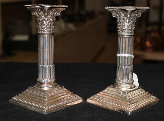 A pair of Victorian silver Corinthian column dwarf candlesticks, Sheffield 1899, Cooper Bros (loaded)
